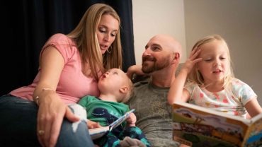 The Hammond family reads bedtime stories.