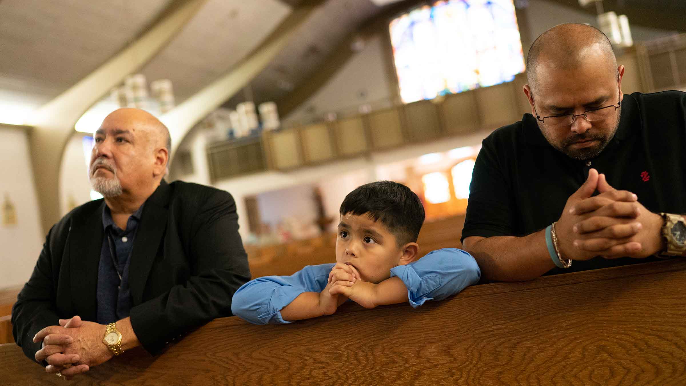 people praying in church.
