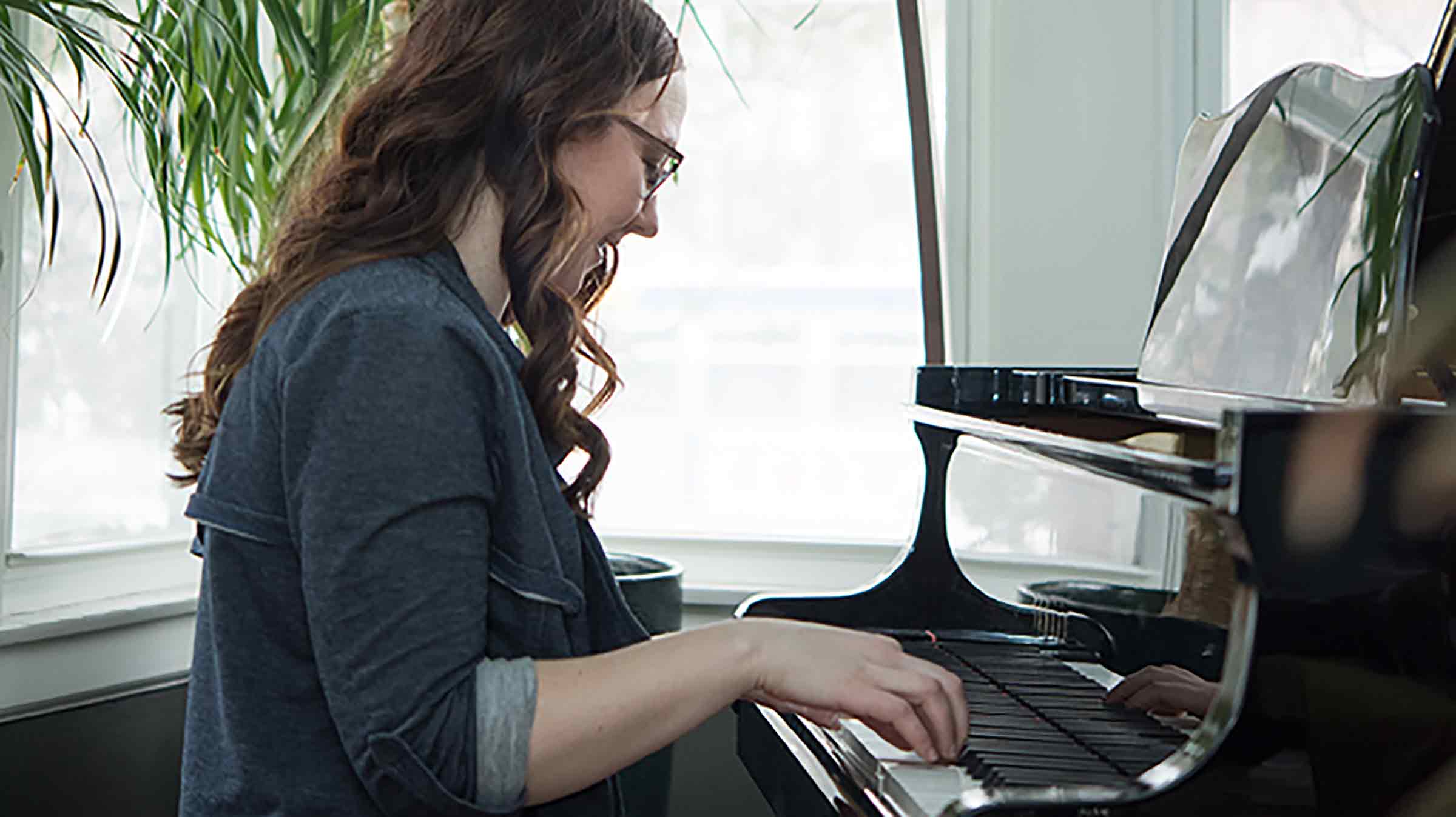 woman playing piano. 