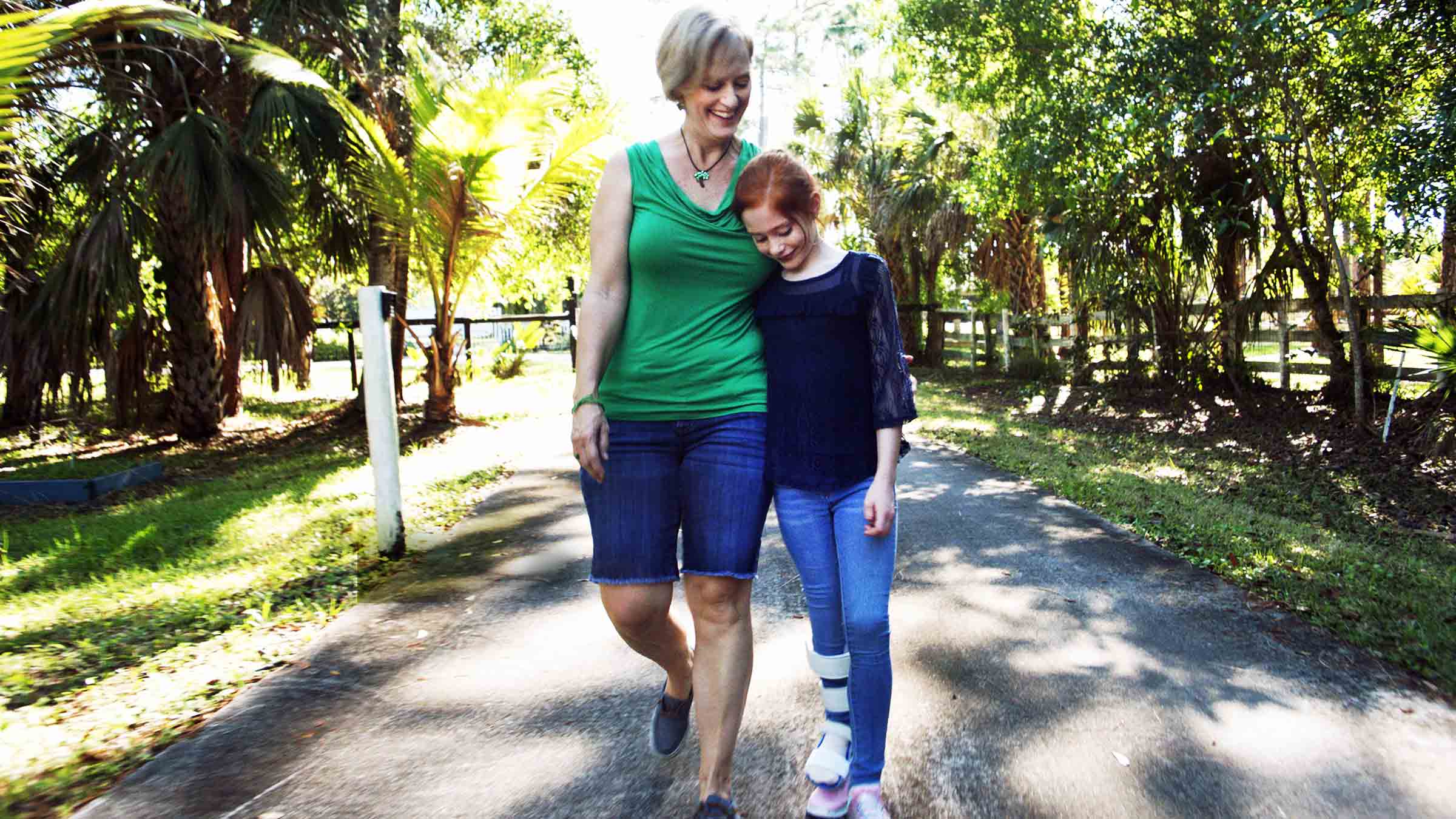 Abby and her mom Jennifer walking side by side.