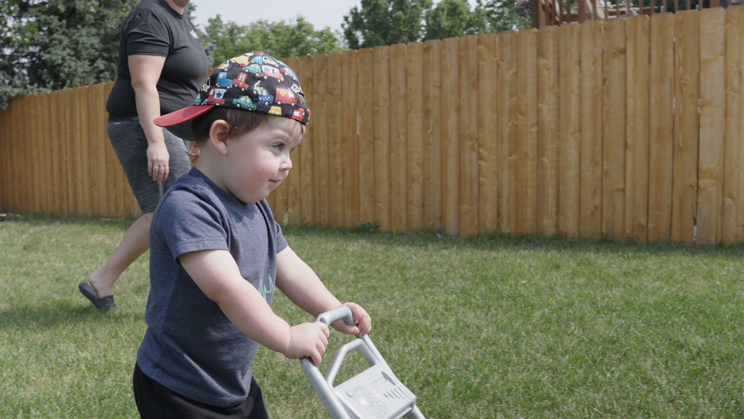 Toddler pushes toy